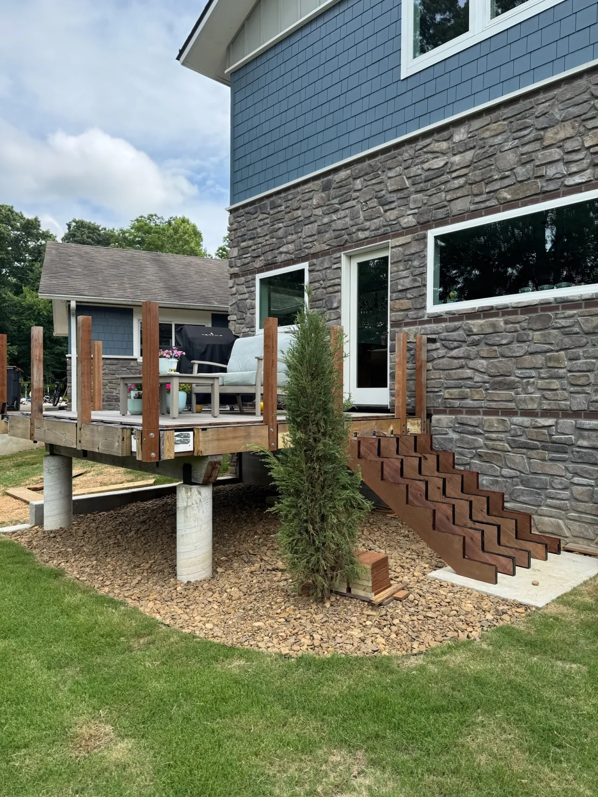 Elevated ipe deck at a stone house