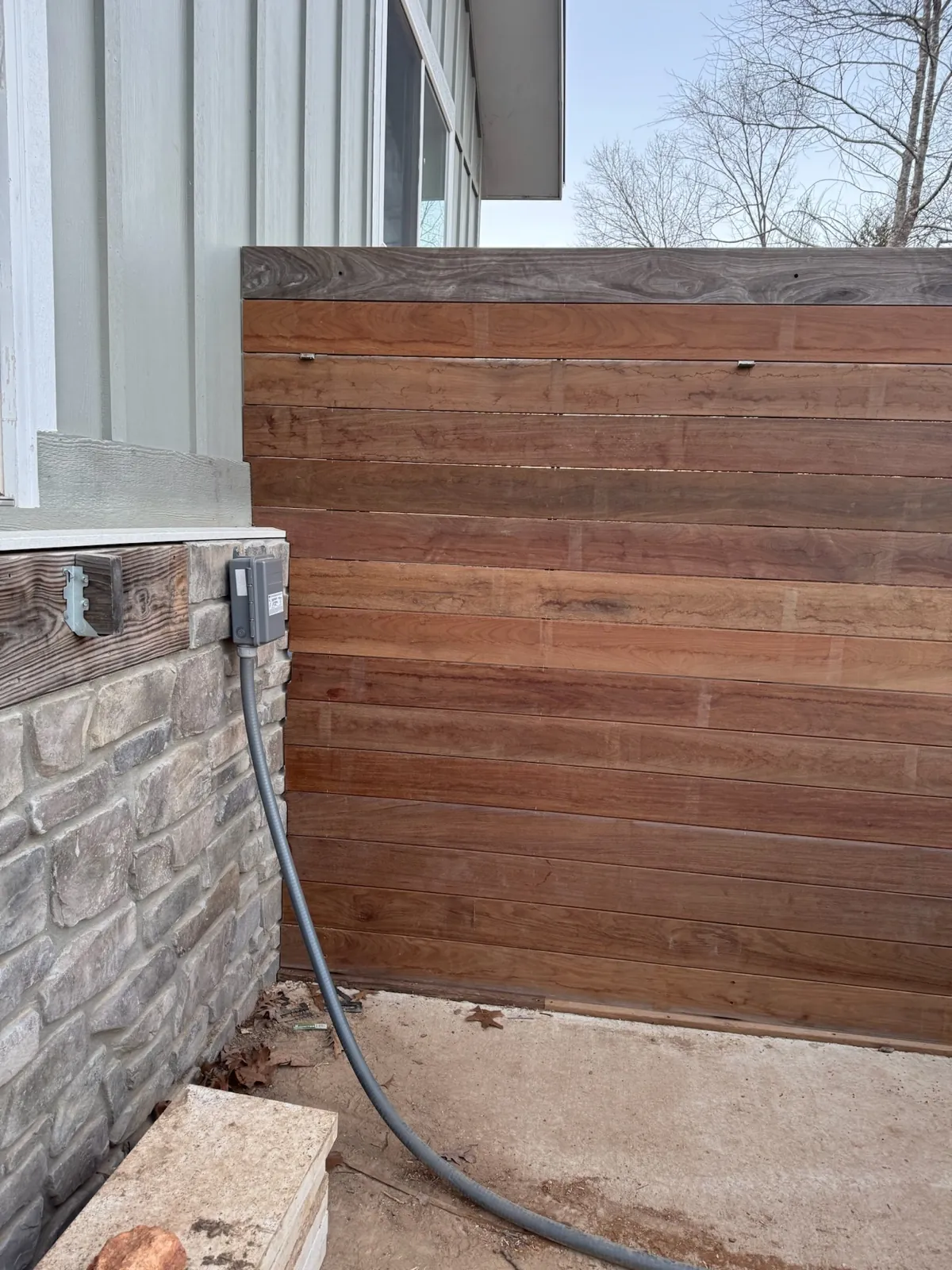 Ipe privacy wall corner meeting stone veneer