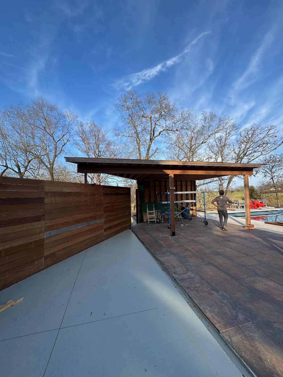 Pergola roof underside with exposed rafters and post