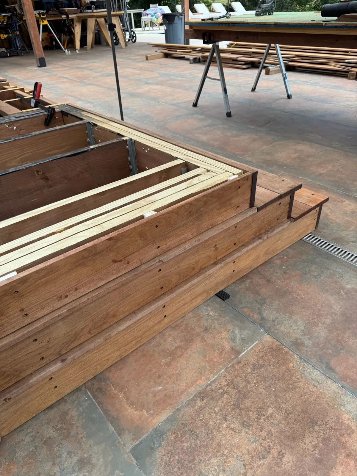 Finished ipe deck corner beside a hot tub